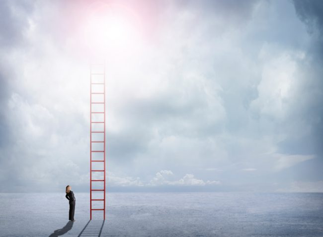 Businesswoman Looks For BPI Solutions in the Cloud Businesswoman Looks Up At Red Ladder Extending Into The Clouds